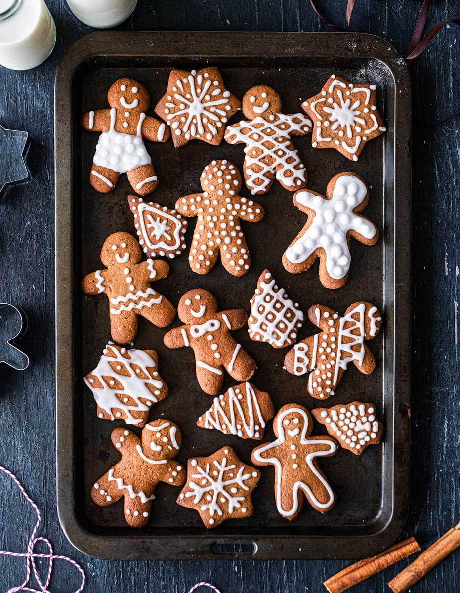 Decorated refined sugar free gingerbread cookies on a baking tray.