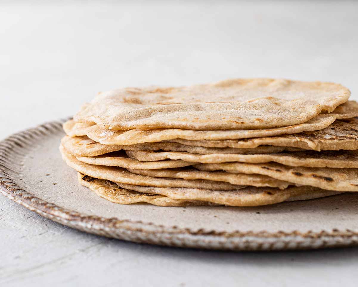 Stack of homemade vegan tortilla taco wrap.