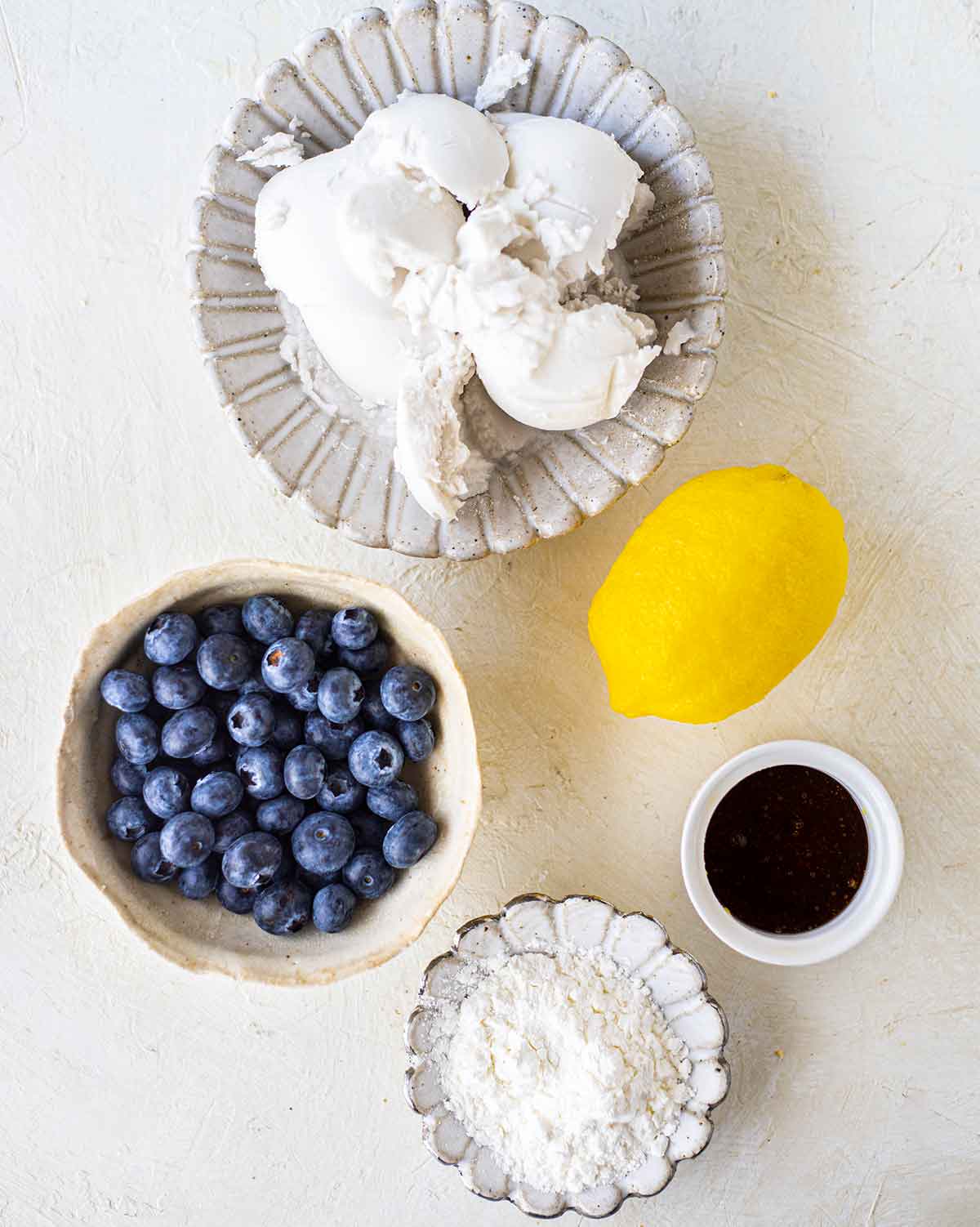 Flatlay of ingredients for the creamy lemon bar filling.