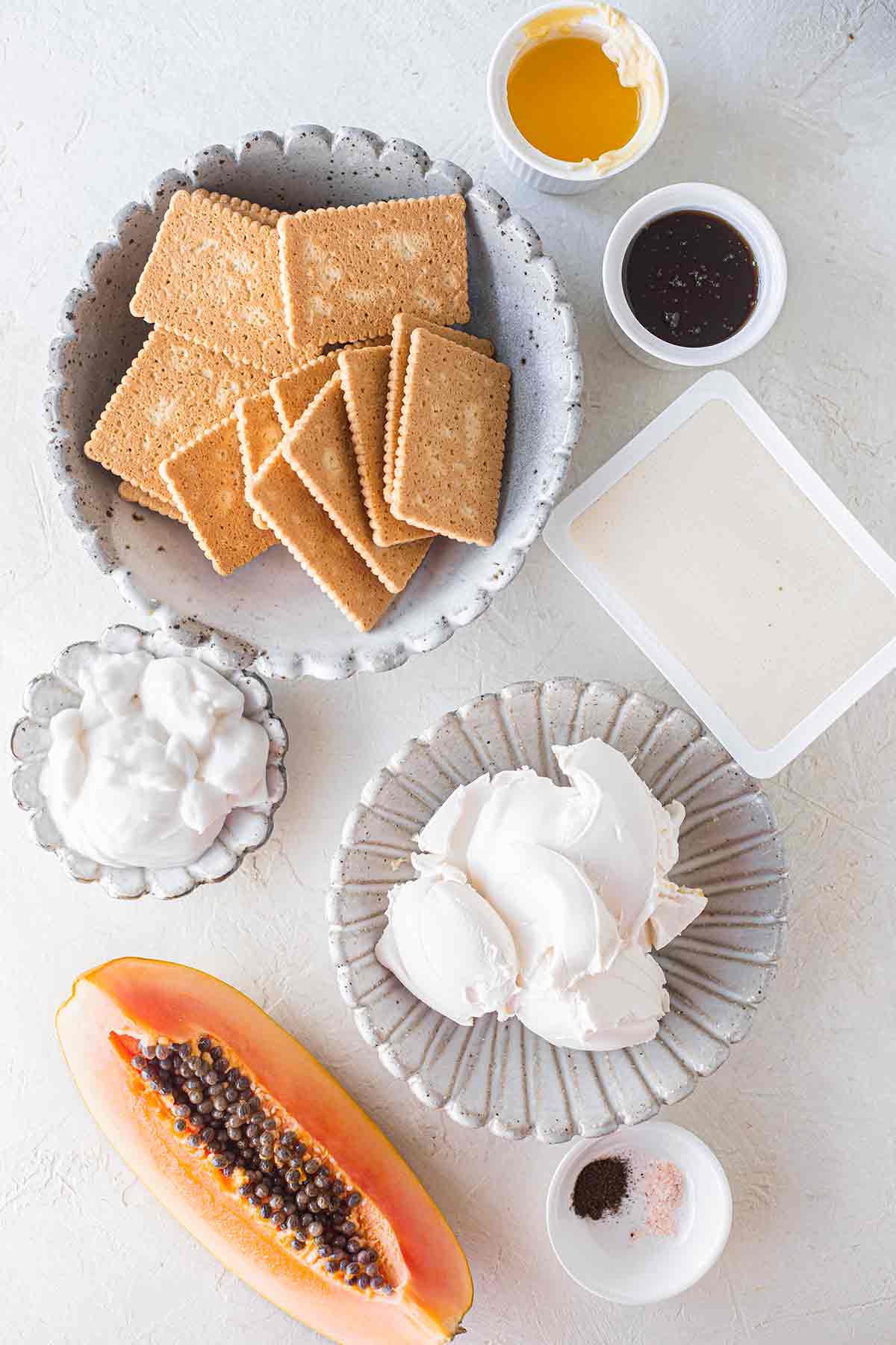 Flatlay of ingredients for papaya cheesecake.