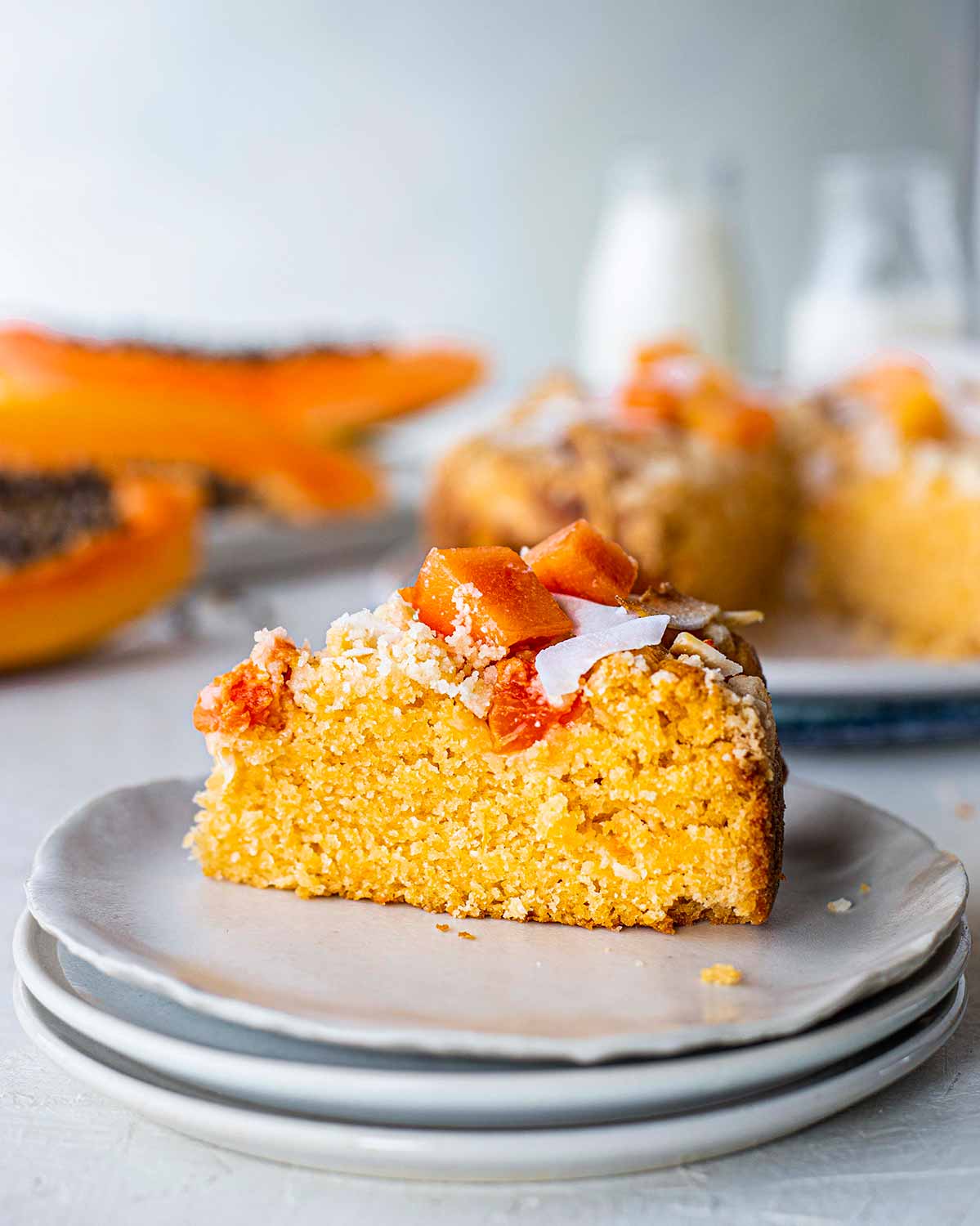 Close up of a beautiful golden slice of papaya cake.