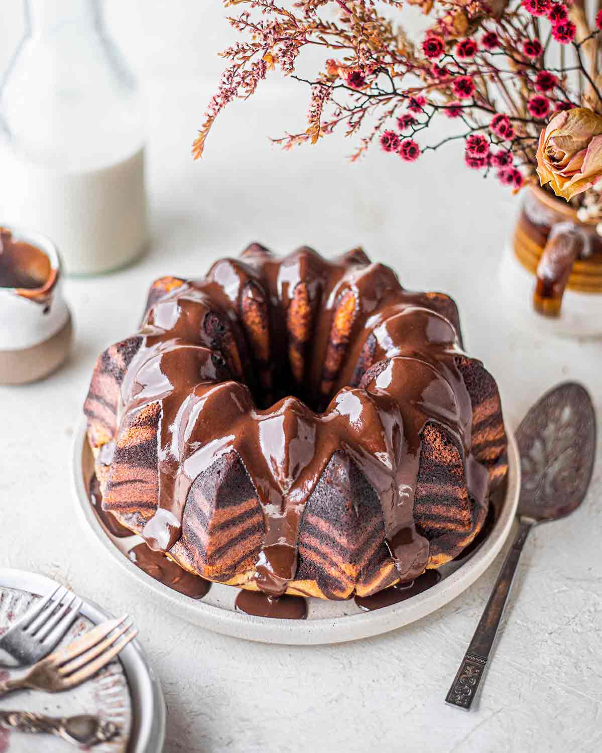 Vegan Zebra Bundt cake with chocolate ganache on top.