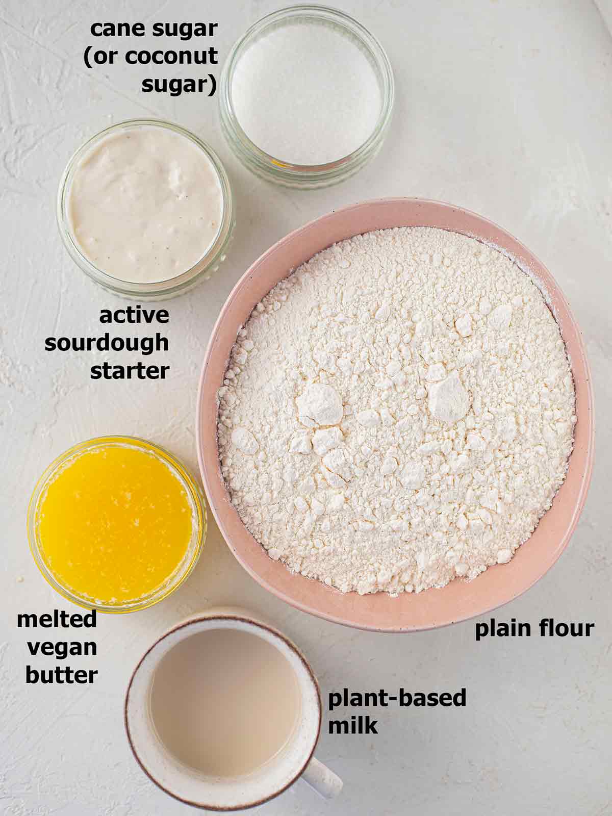Flatlay of ingredients of the vegan sourdough cinnamon rolls without yeast.