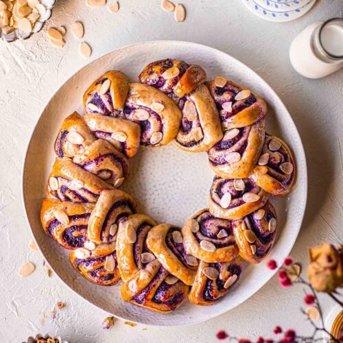 https://www.rainbownourishments.com/wp-content/uploads/2020/12/blueberry-almond-cinnamon-roll-christmas-wreath-recipe-1-500x500.jpg