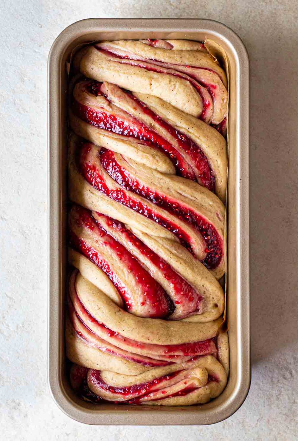 Raspberry Jam Donut Babka in baking tin