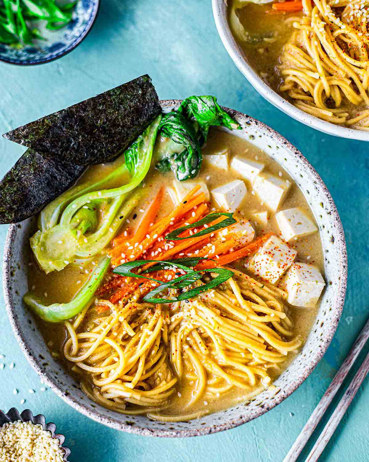 Close up of easy quick vegan ramen noodle soup with miso sesame broth.