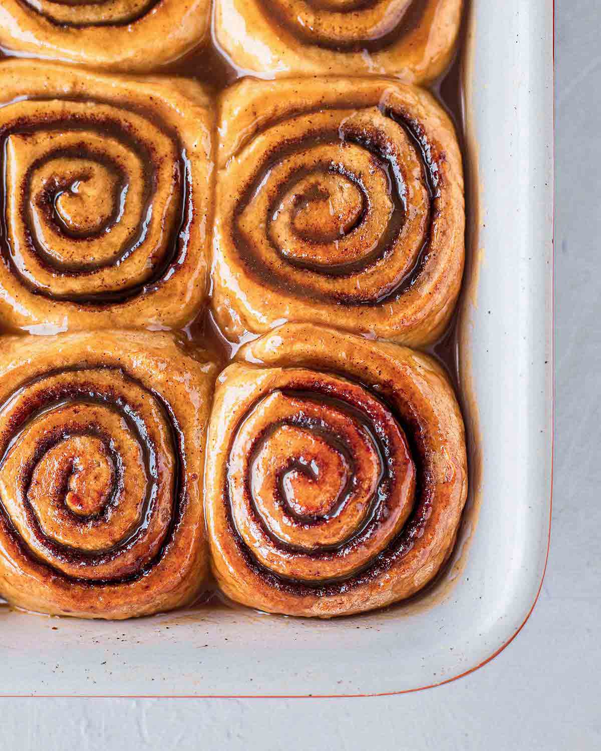 Close up of sticky buns in baking tray.