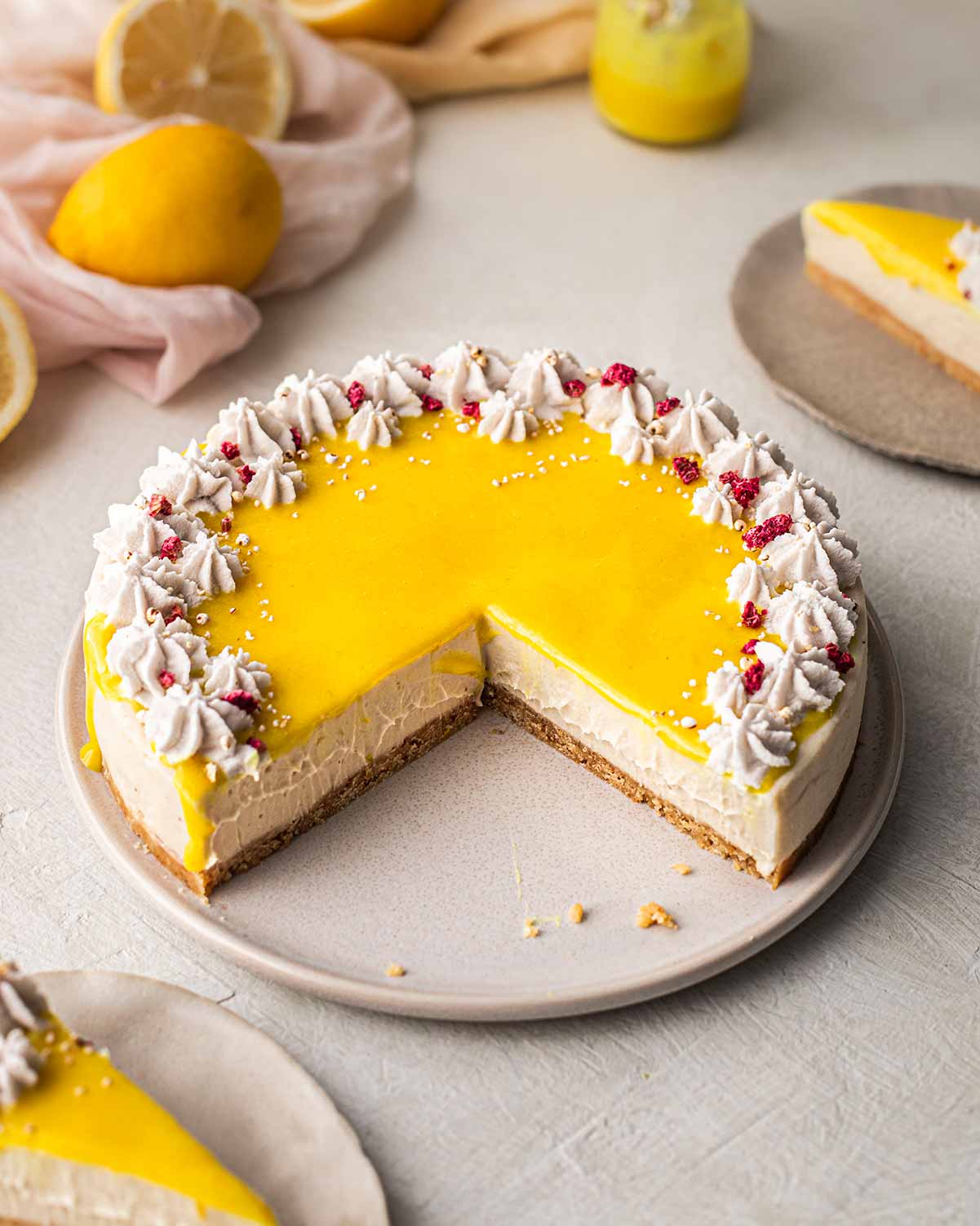 Symmetrical image of cheesecake with golden lemon curd on top