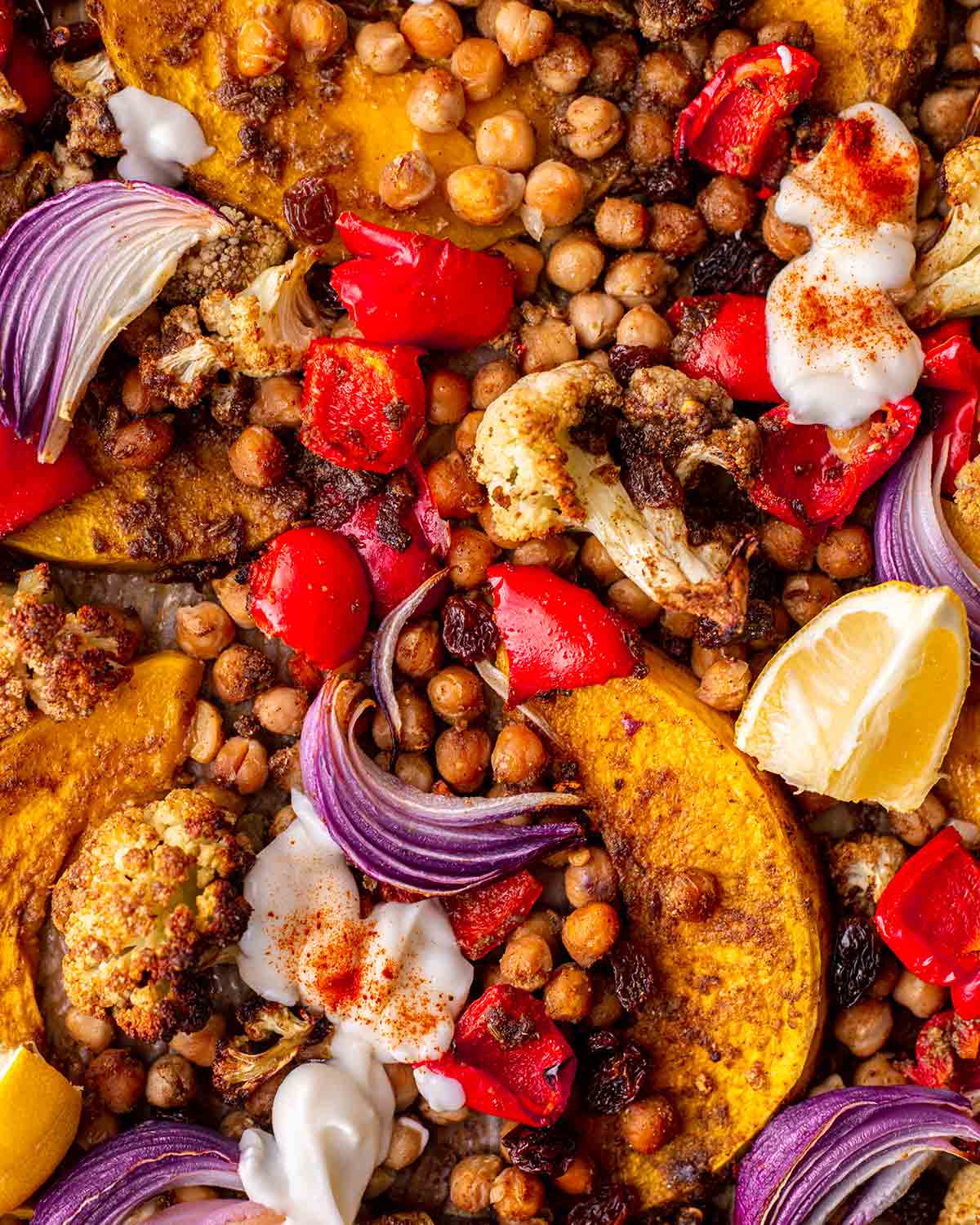 close up of roasted and spiced vegetables on baking tray