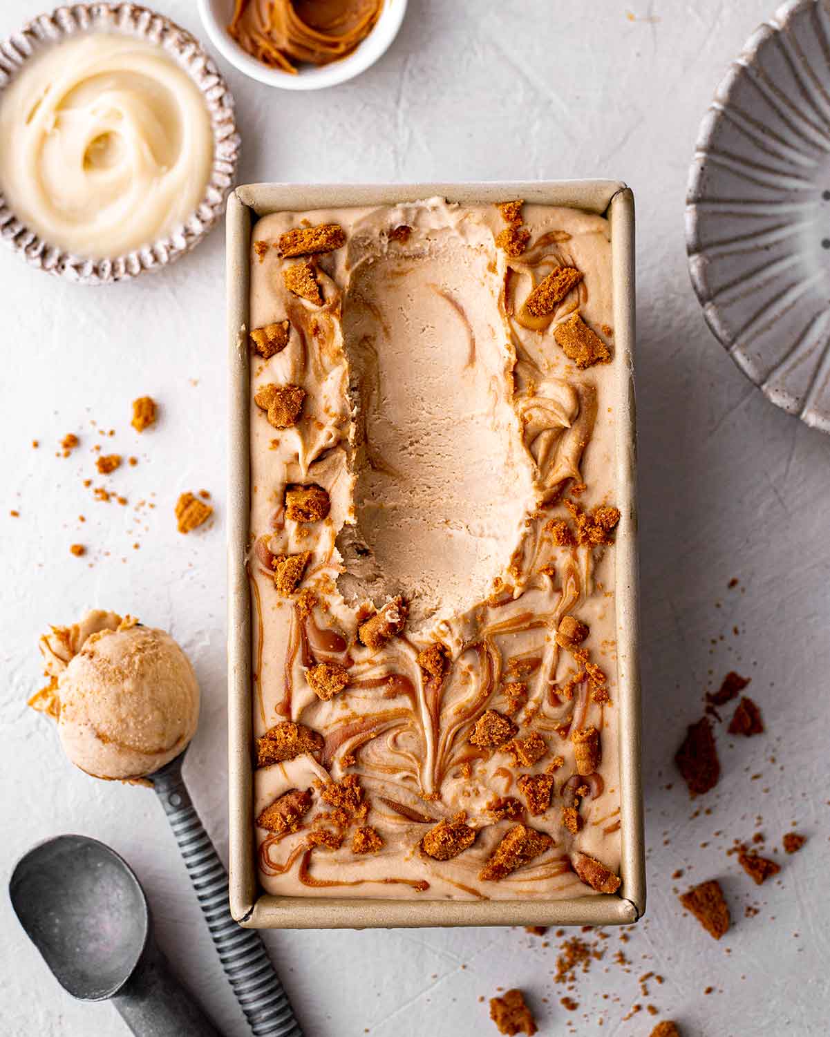 Ice cream in loaf pan showing cream texture.