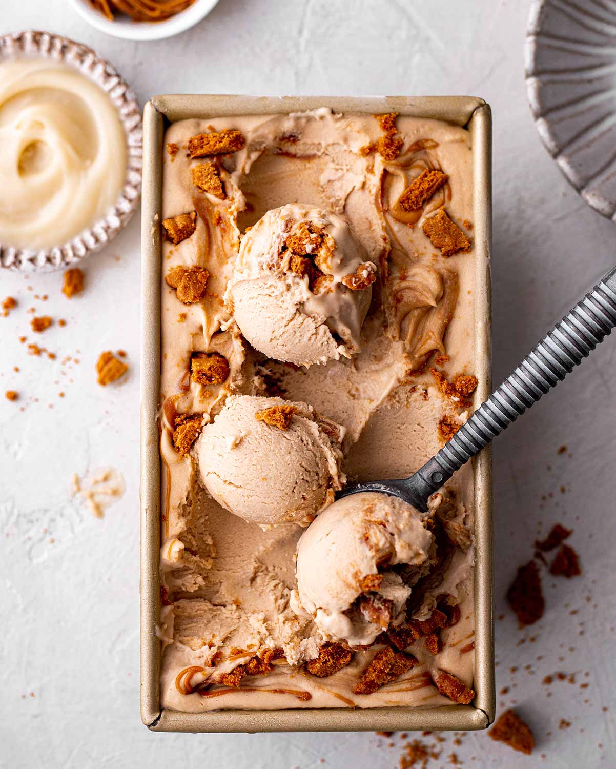 Close up of ice cream scoops in loaf pan.