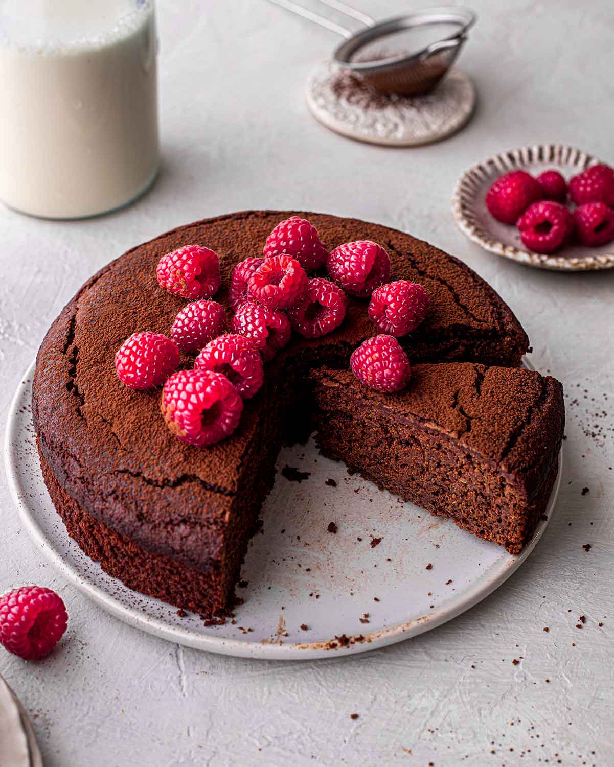 Side top angle of chocolate cake with fudgy piece coming out.