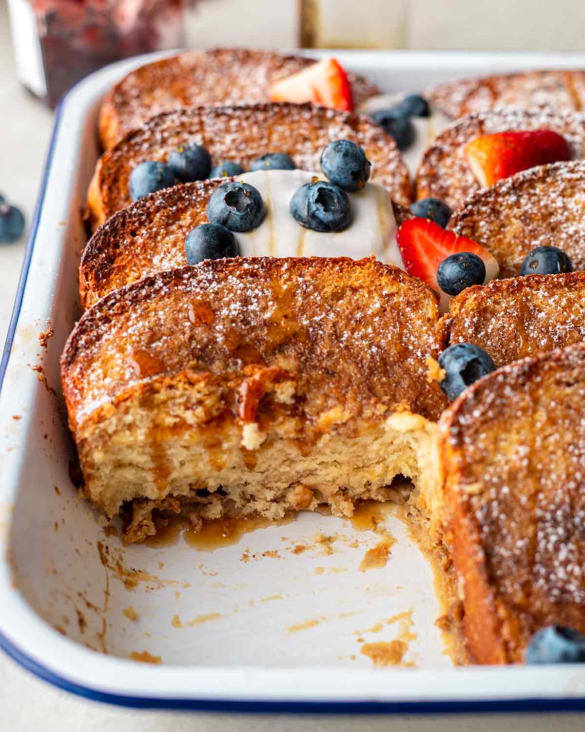 Close up of custardy and soft texture of a slice cut out of french toast casserole.