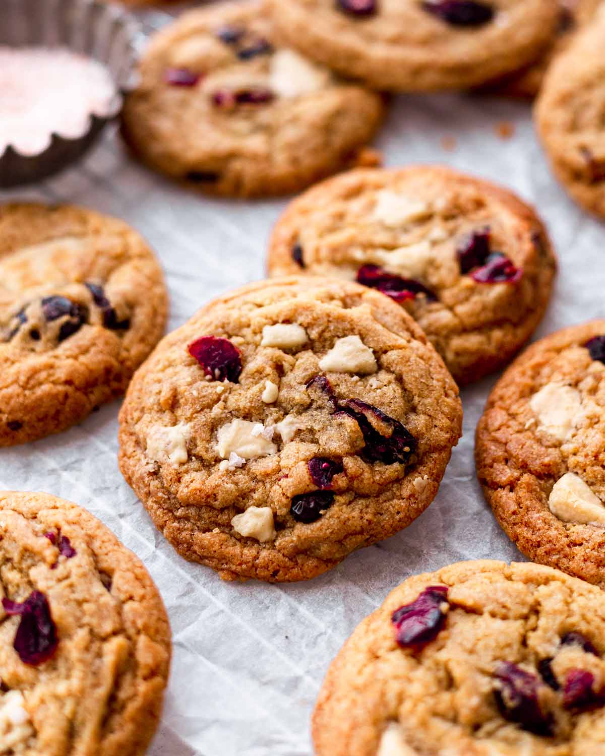 Angled close up of one cookie should golden and chewy texture.