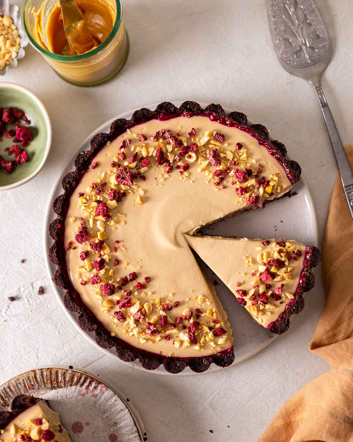 Overhead image of pie showing freeze dried raspberry and peanut butter decorations.