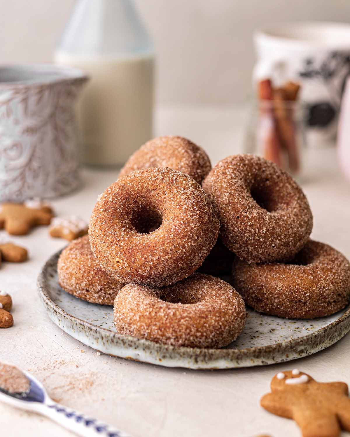 Stack of gingerbread donuts coated in ginger cinnamon sugar coating.