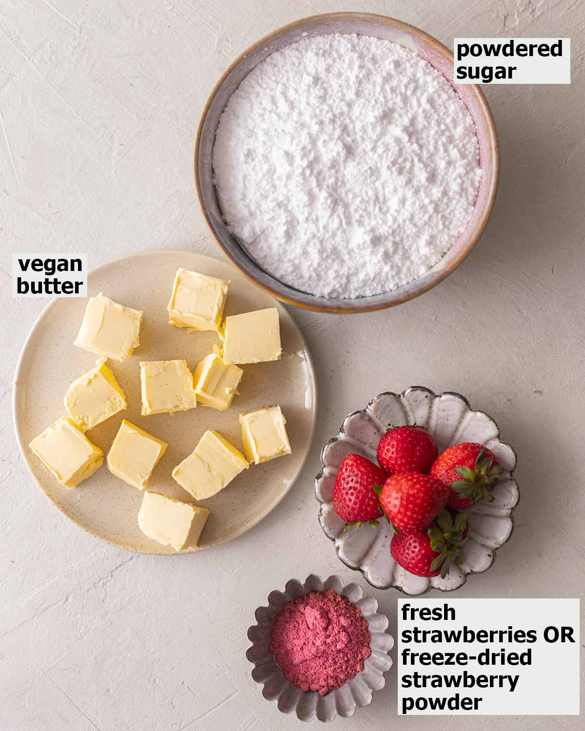 Flatlay of ingredients for strawberry frosting.