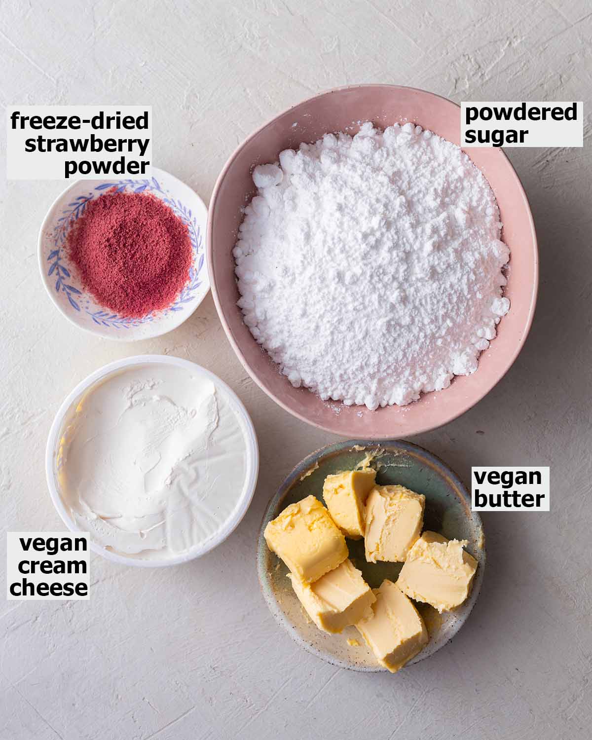 Flatlay of ingredients for strawberry frosting.