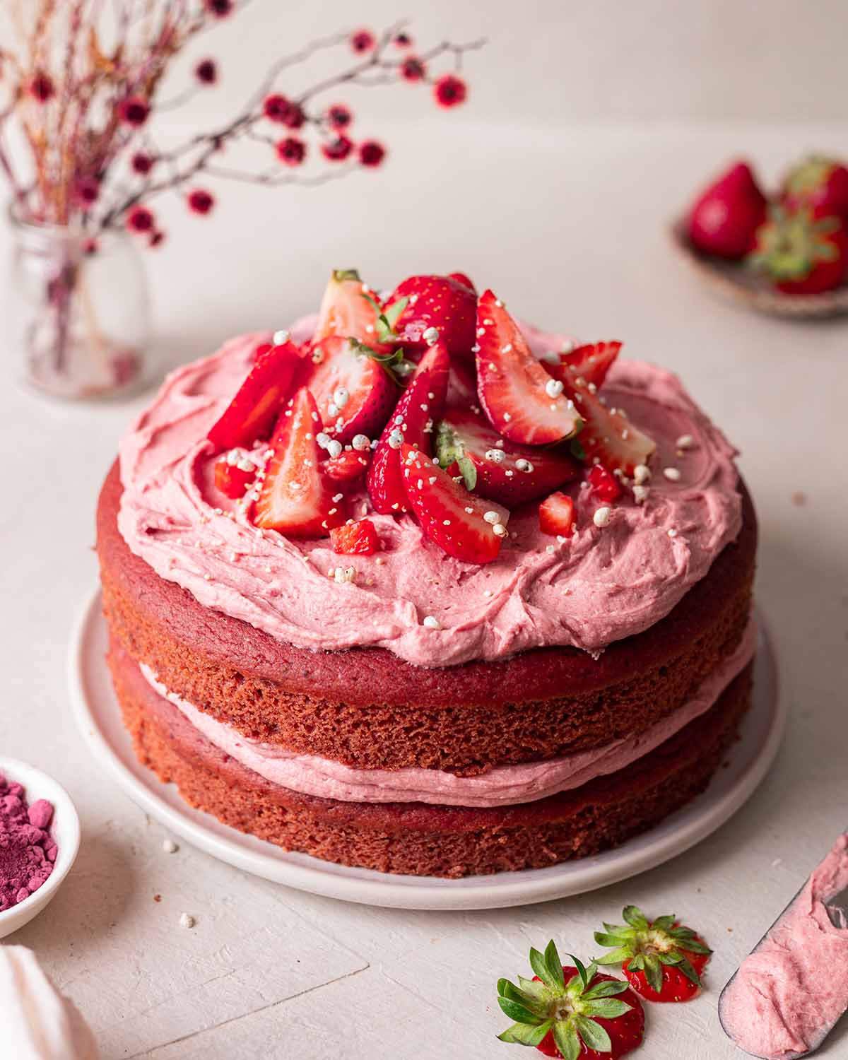 Vegan Strawberry Cake with strawberry buttercream on top.