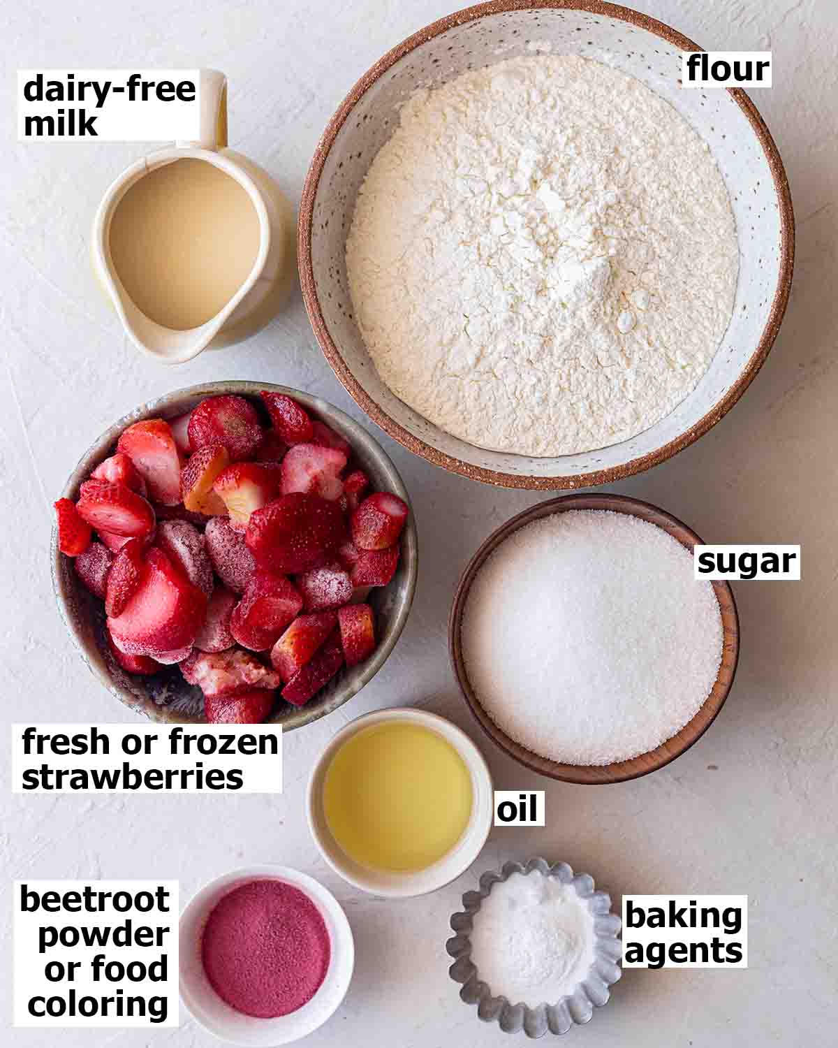 Flatlay of ingredients for strawberry cupcakes.