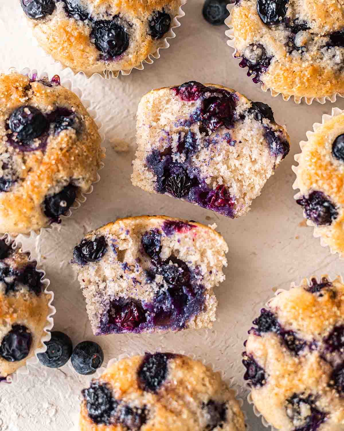 Close up of cross section of one muffin showing brightly colored berries.