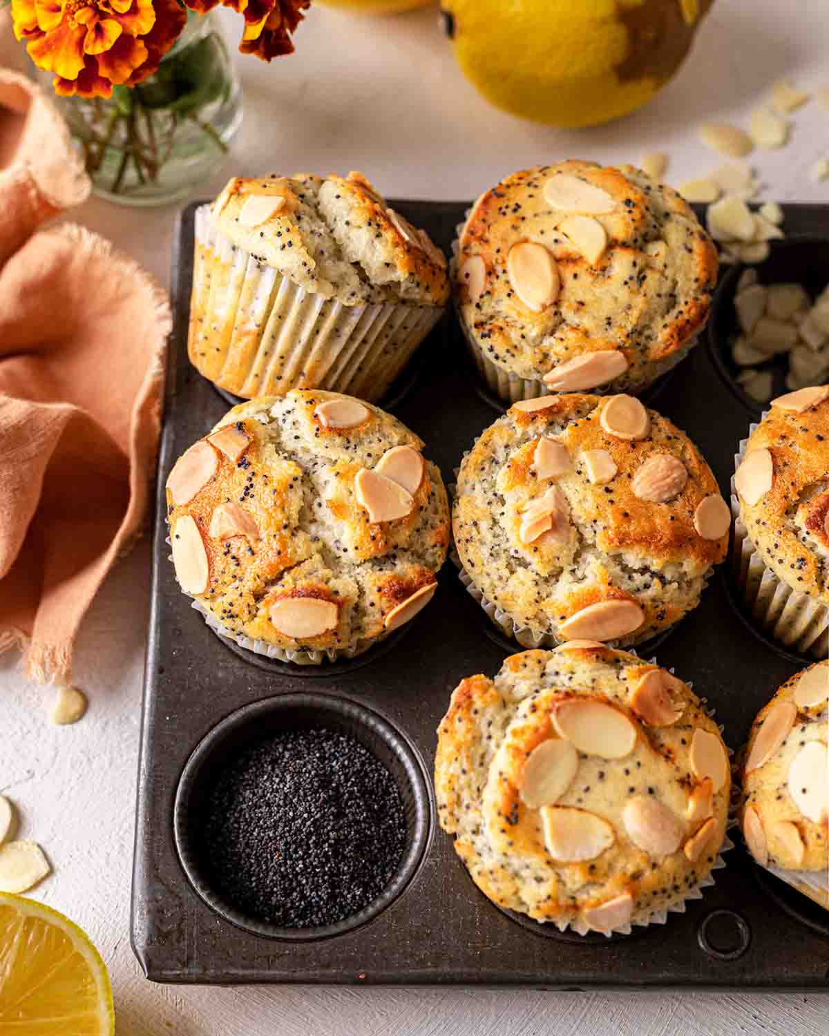 Angled image of poppy seed muffins focusing on golden brown surface.