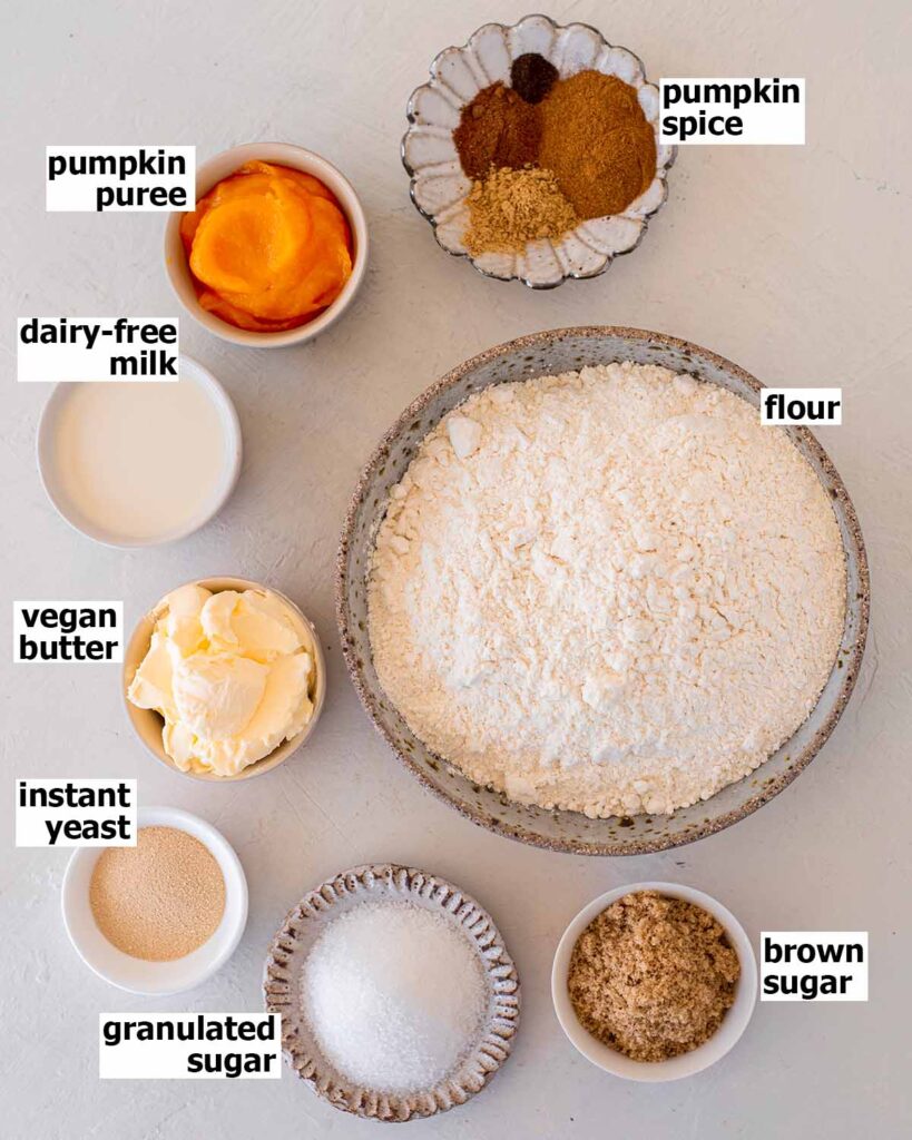 Flatlay of simple ingredients to make vegan pumpkin cinnamon rolls.