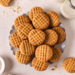 Lots of 3 ingredient peanut butter cookies on a decorative plate.