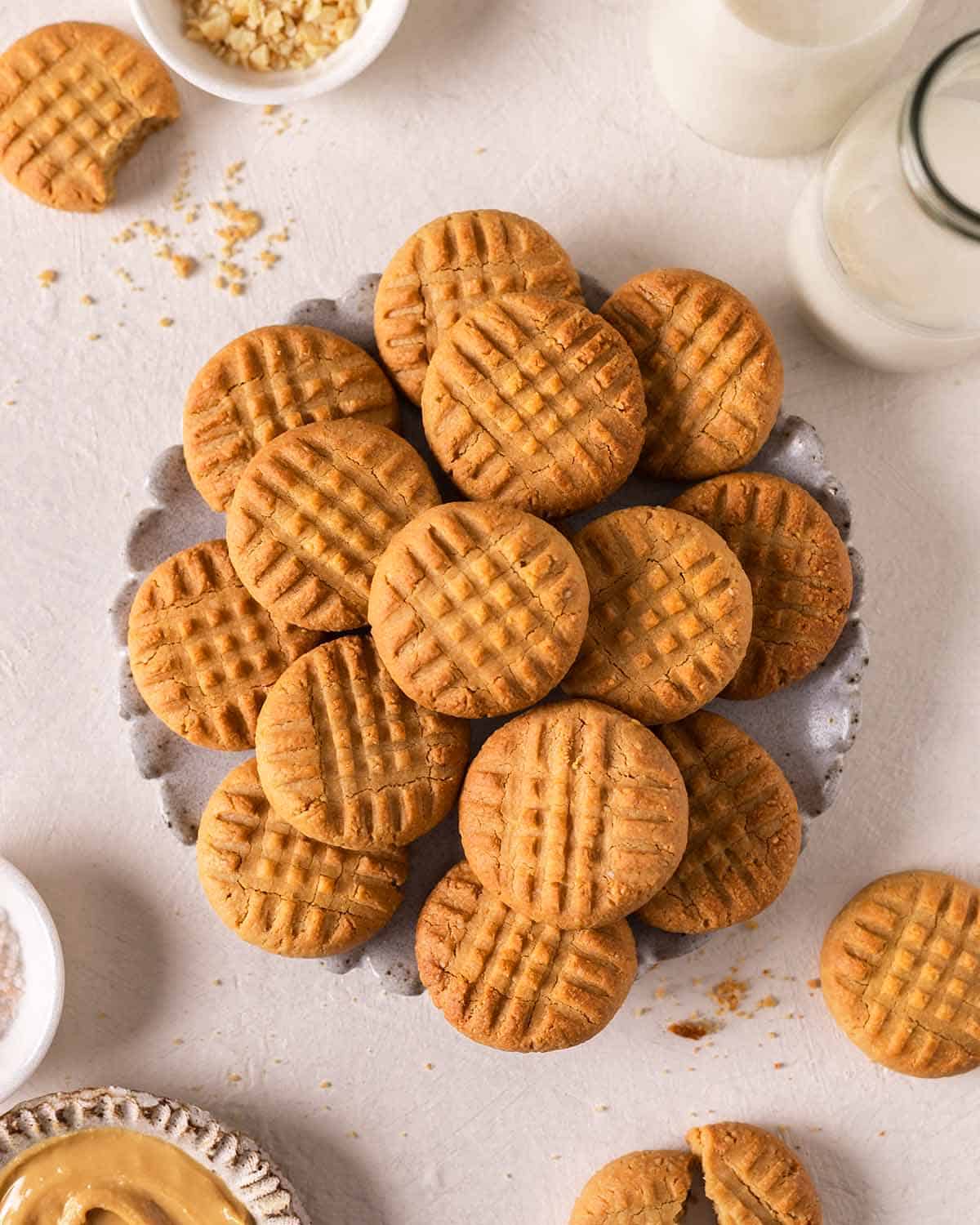 Lots of 3 ingredient peanut butter cookies on a decorative plate.