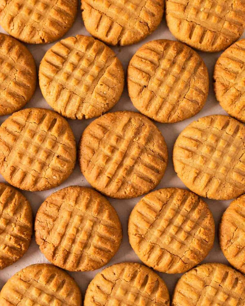 Flatlay of peanut butter cookies emphasising criss cross pattern..