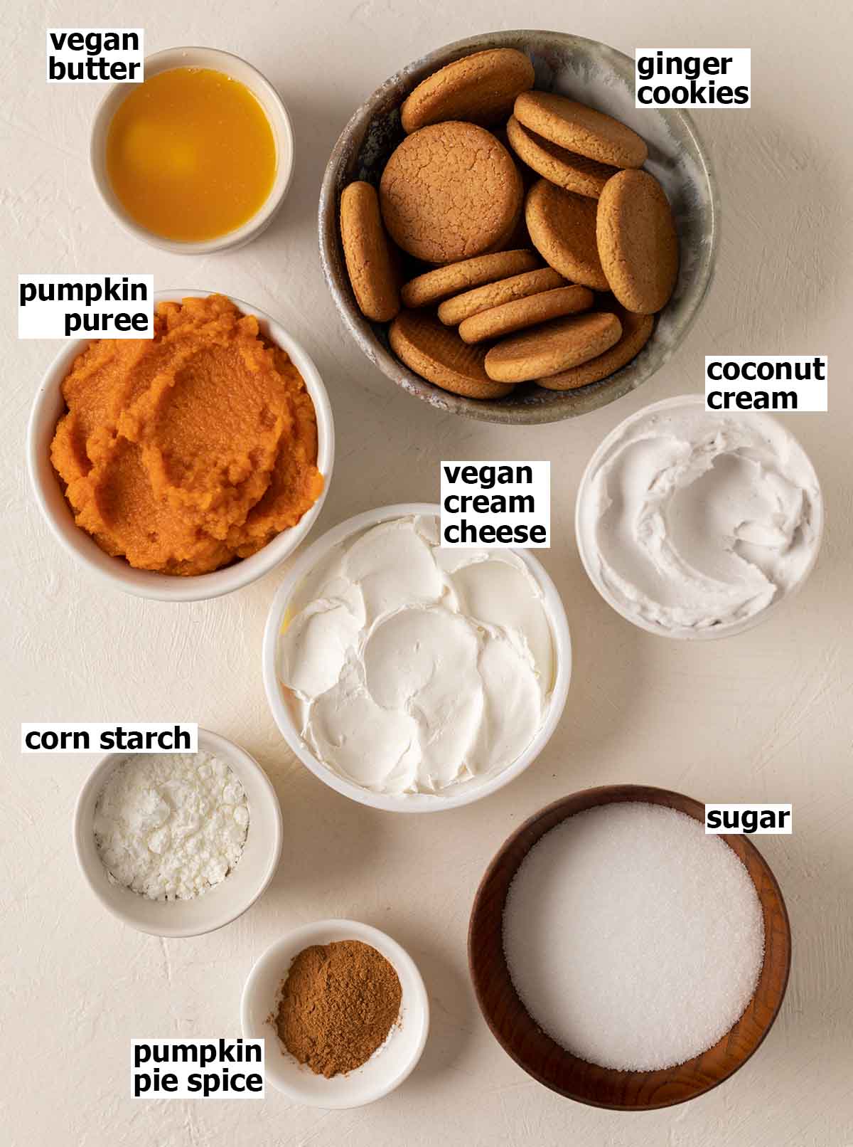 Flatlay of ingredients for pumpkin cheesecake.