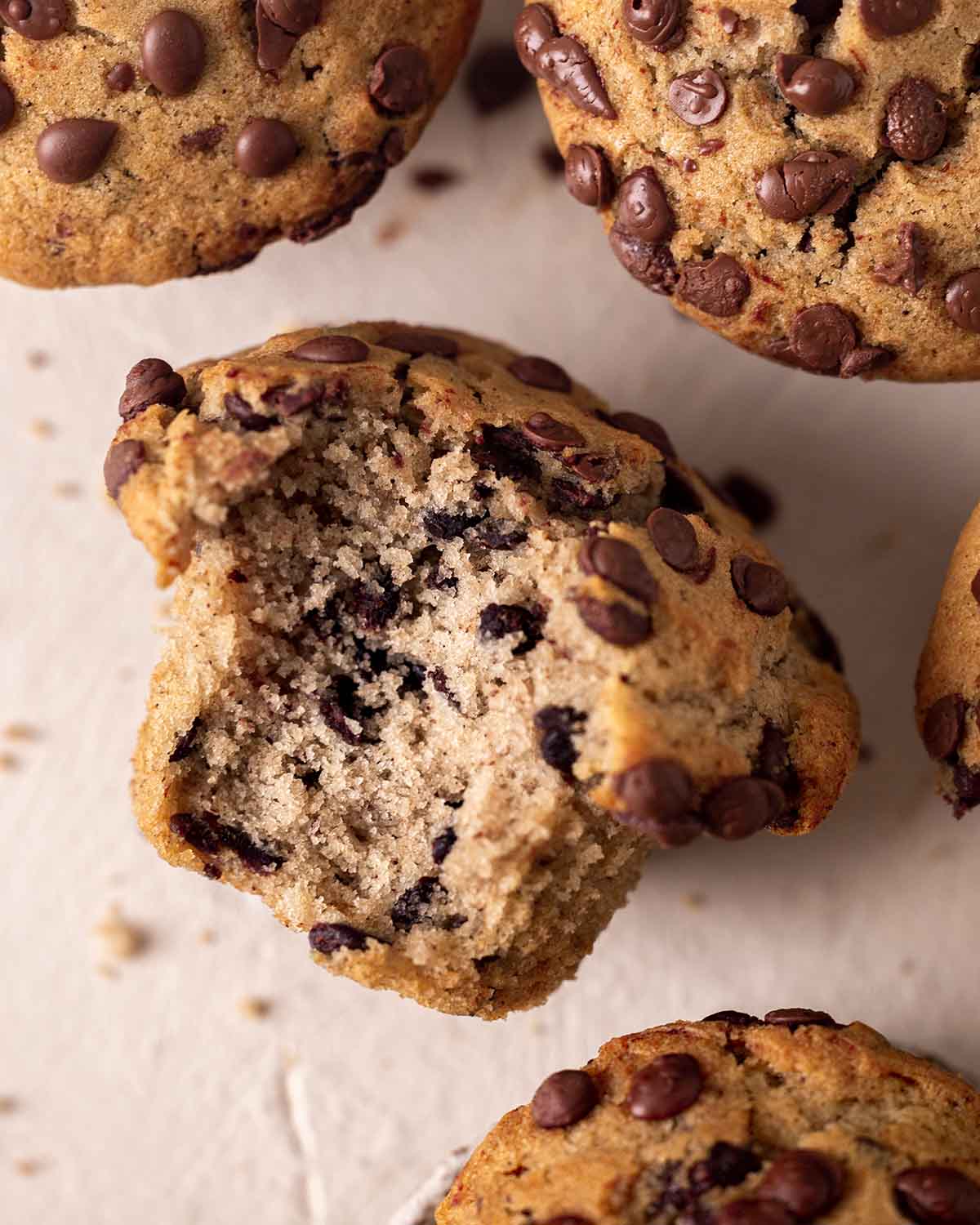 Close up of bitten cross-section of one muffin.