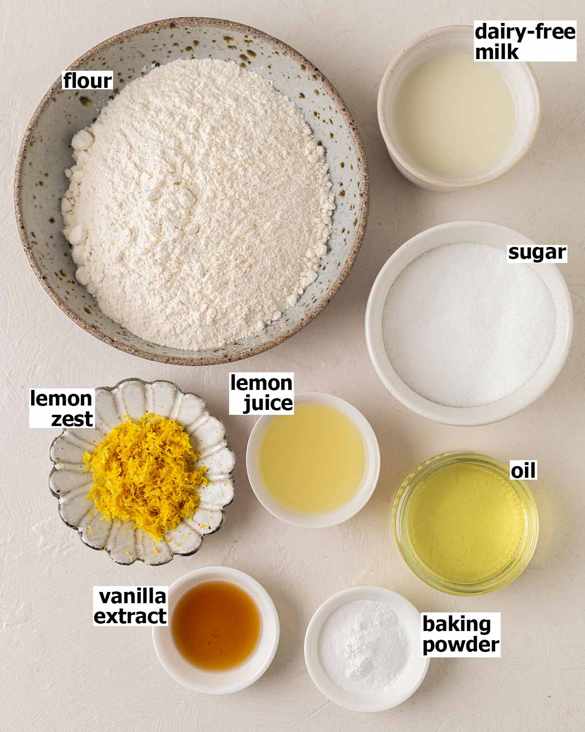 Flat-lay of ingredients for vegan lemon cupcakes.