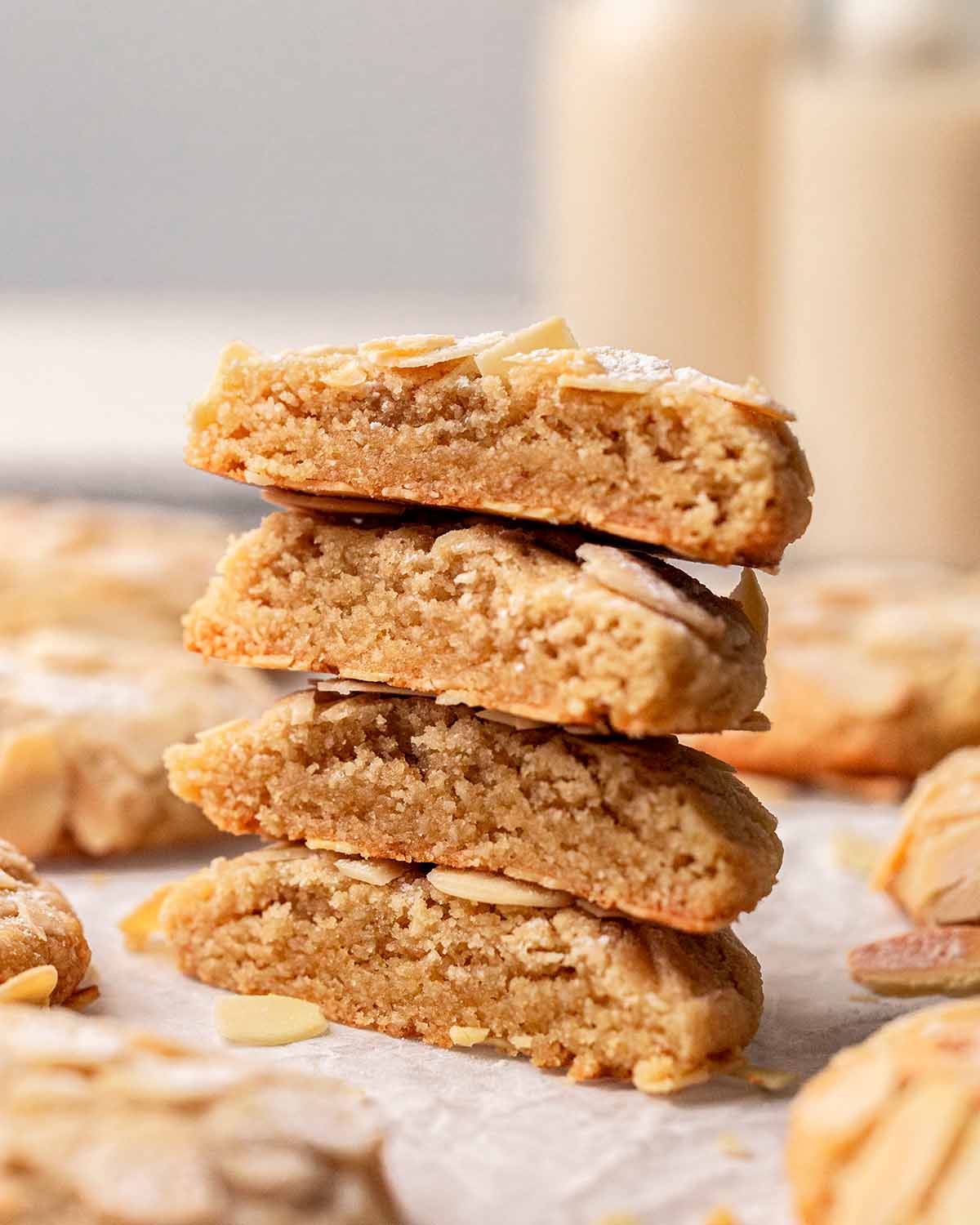 Stack of cookies that have been cut in half showing rich and golden brown interior.