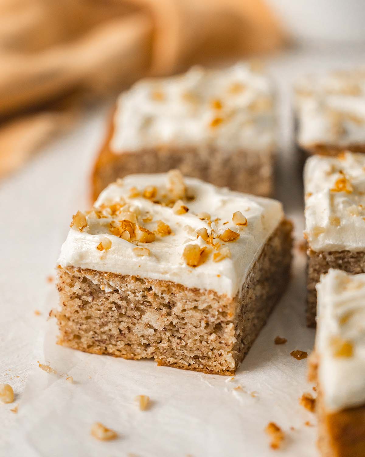 Close up of one slice of banana cake showing light and fluffy texture.