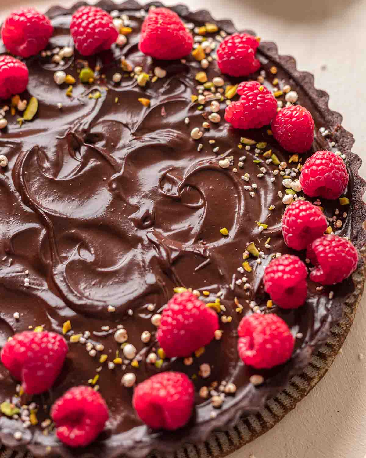 Close up of avocado tart and decorations.