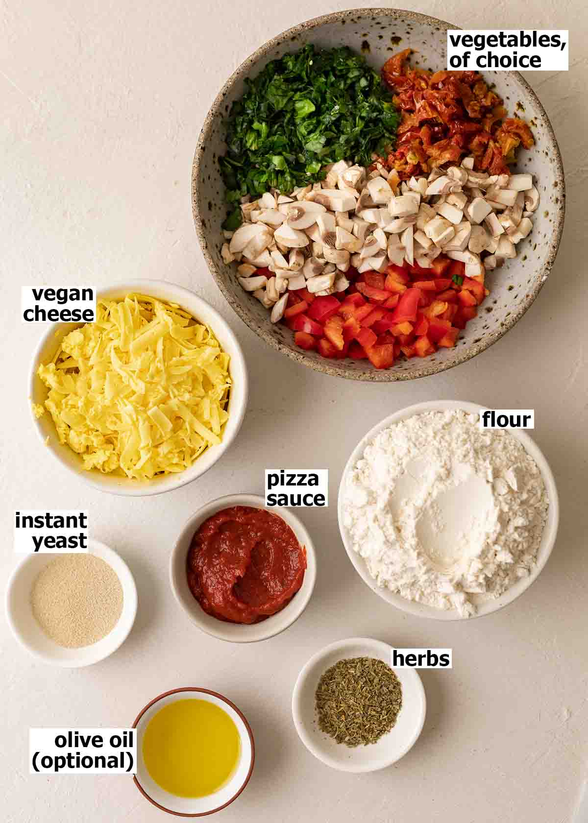 Flat-lay of ingredients for pizza rolls and homemade dough.