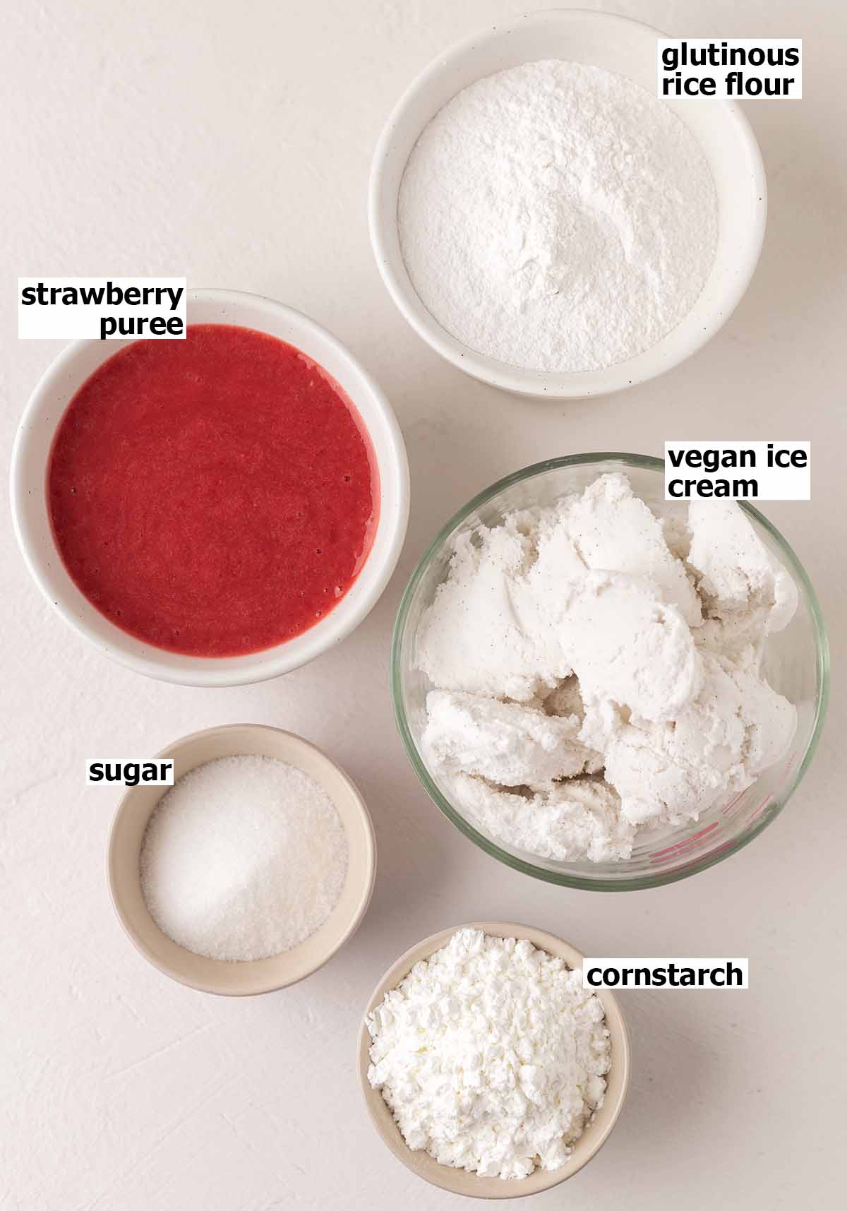 Flat-lay of 5 key ingredients for strawberry ice cream mochi.