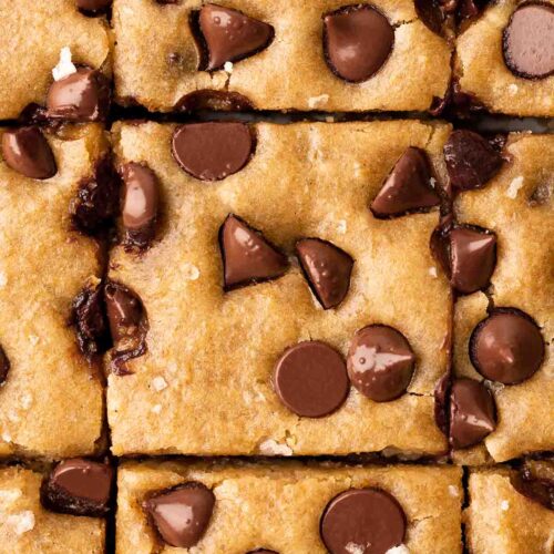 Close up of top of chickpea blondies cut into bars.