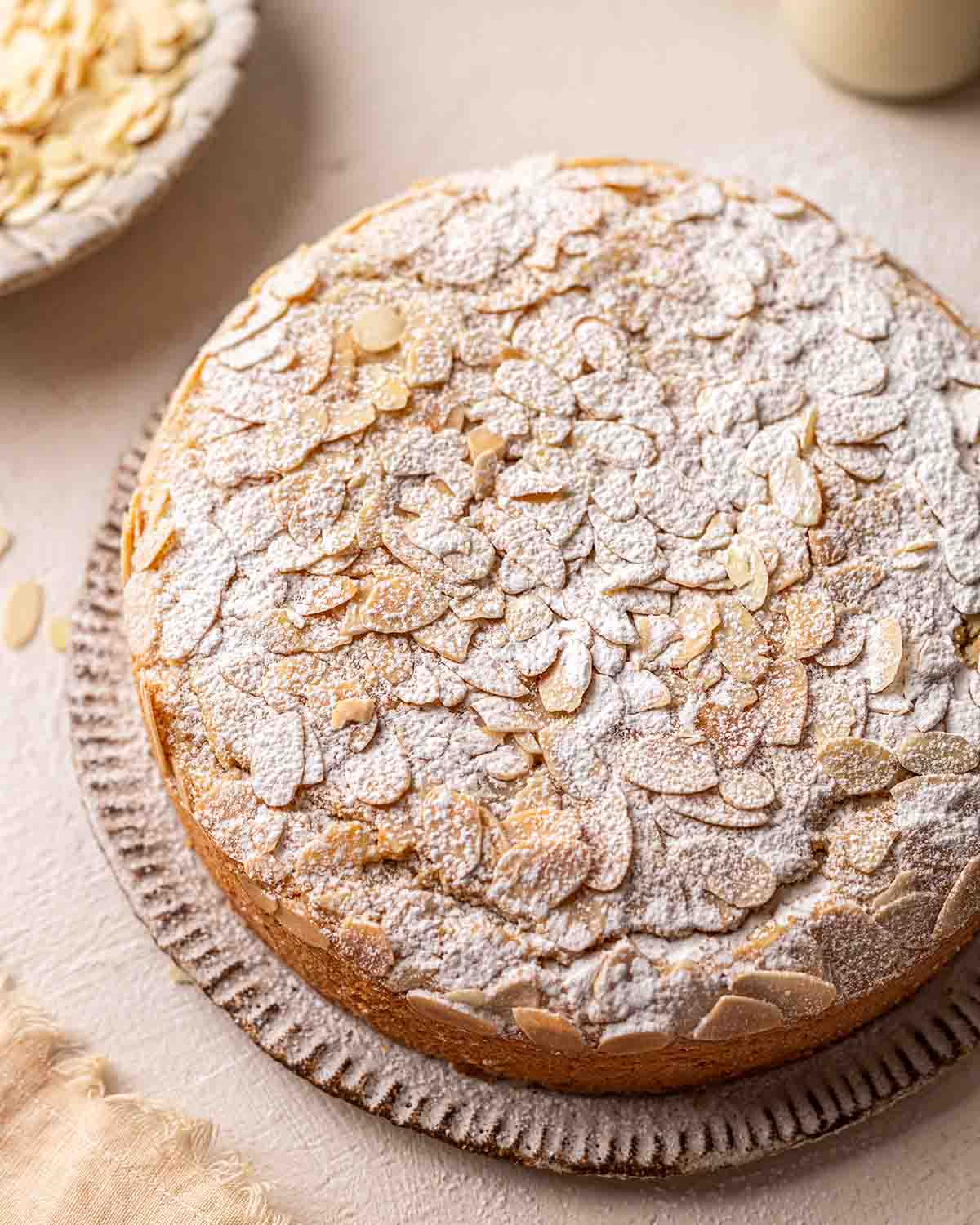 Almond cake with light dusting of powdered sugar. 