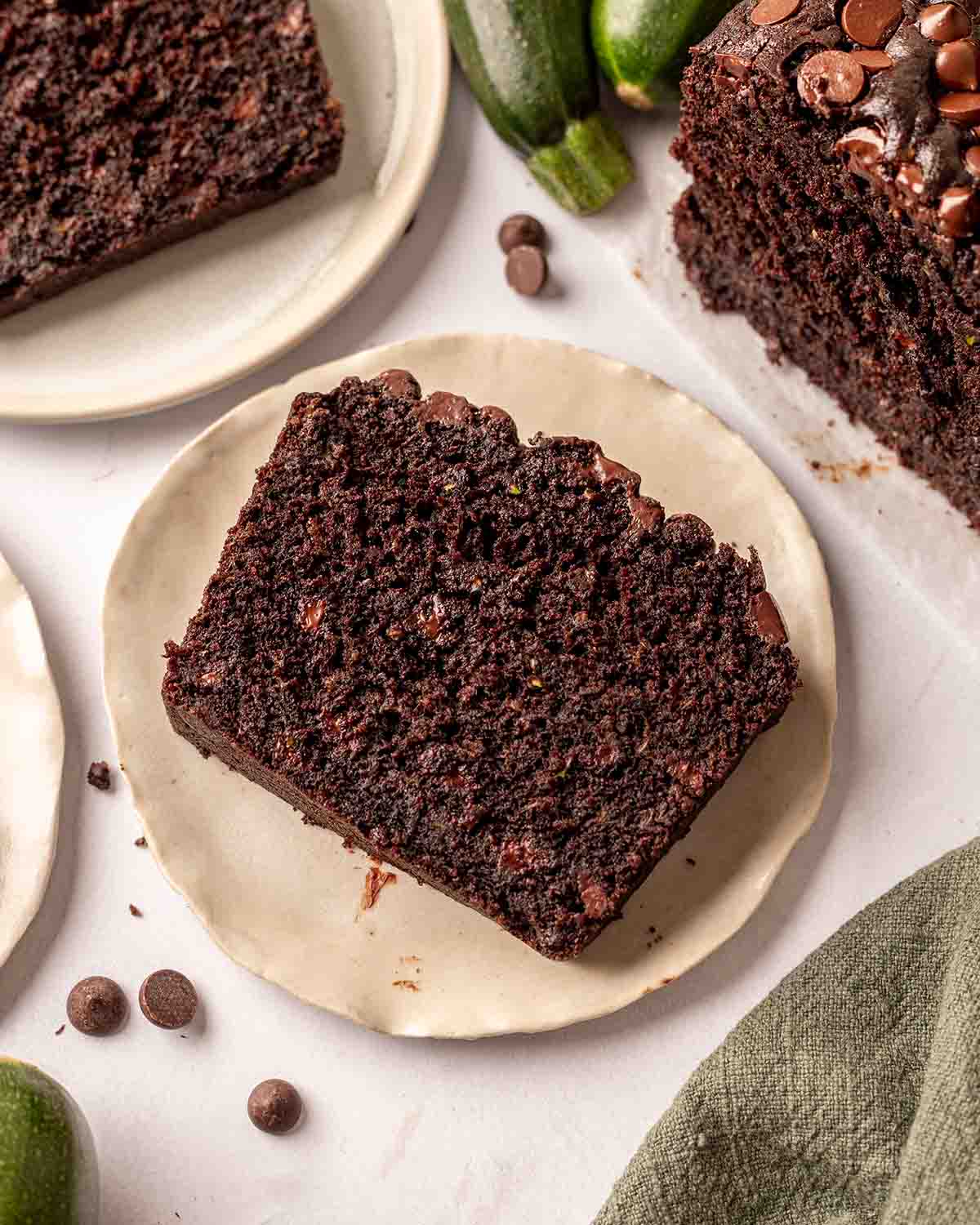 Close up of one slice of zucchini chocolate bread showing fudgy and soft texture.