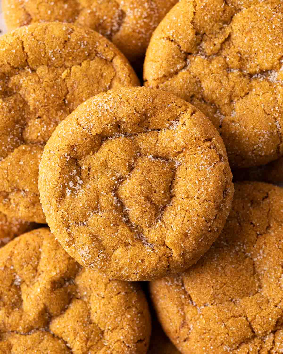 Overhead image of pumpkin cookies stacked on top of each other.