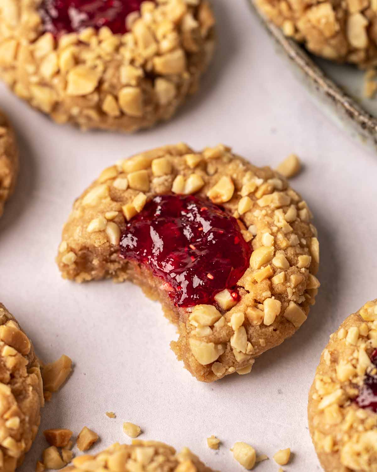 Close up of peanut butter cookie with bite taken out.