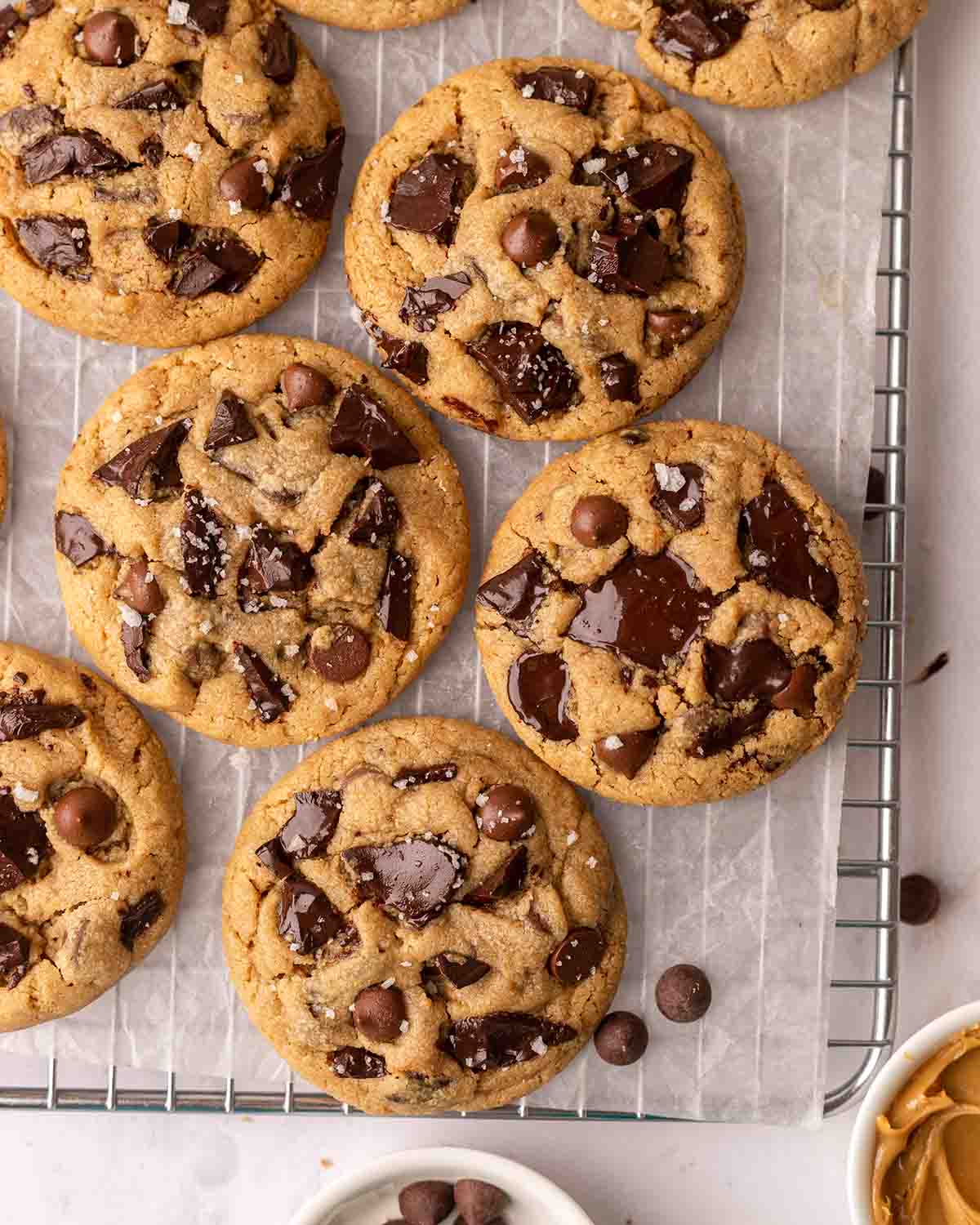 Overhead image of rustic cookies on parchment paper and wire rack.