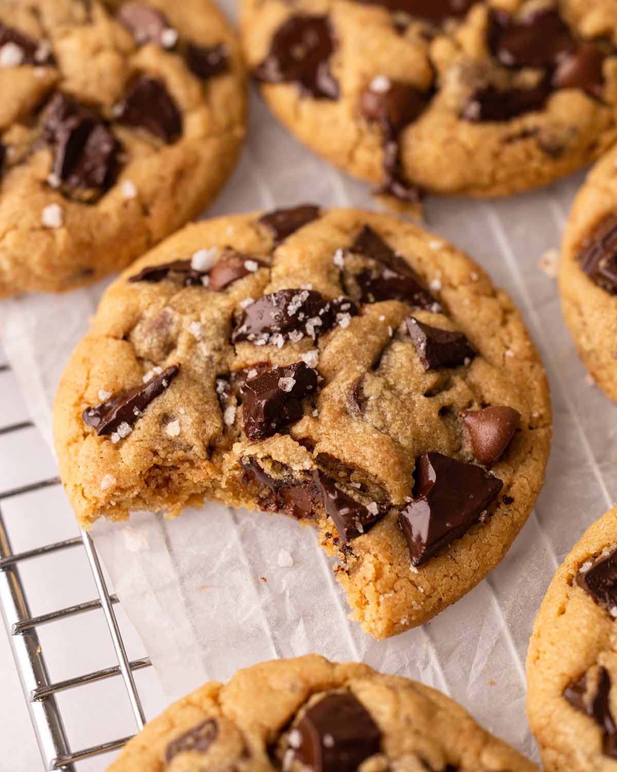 Close up of cookie with a bite taken out revealing the soft cookie interior.