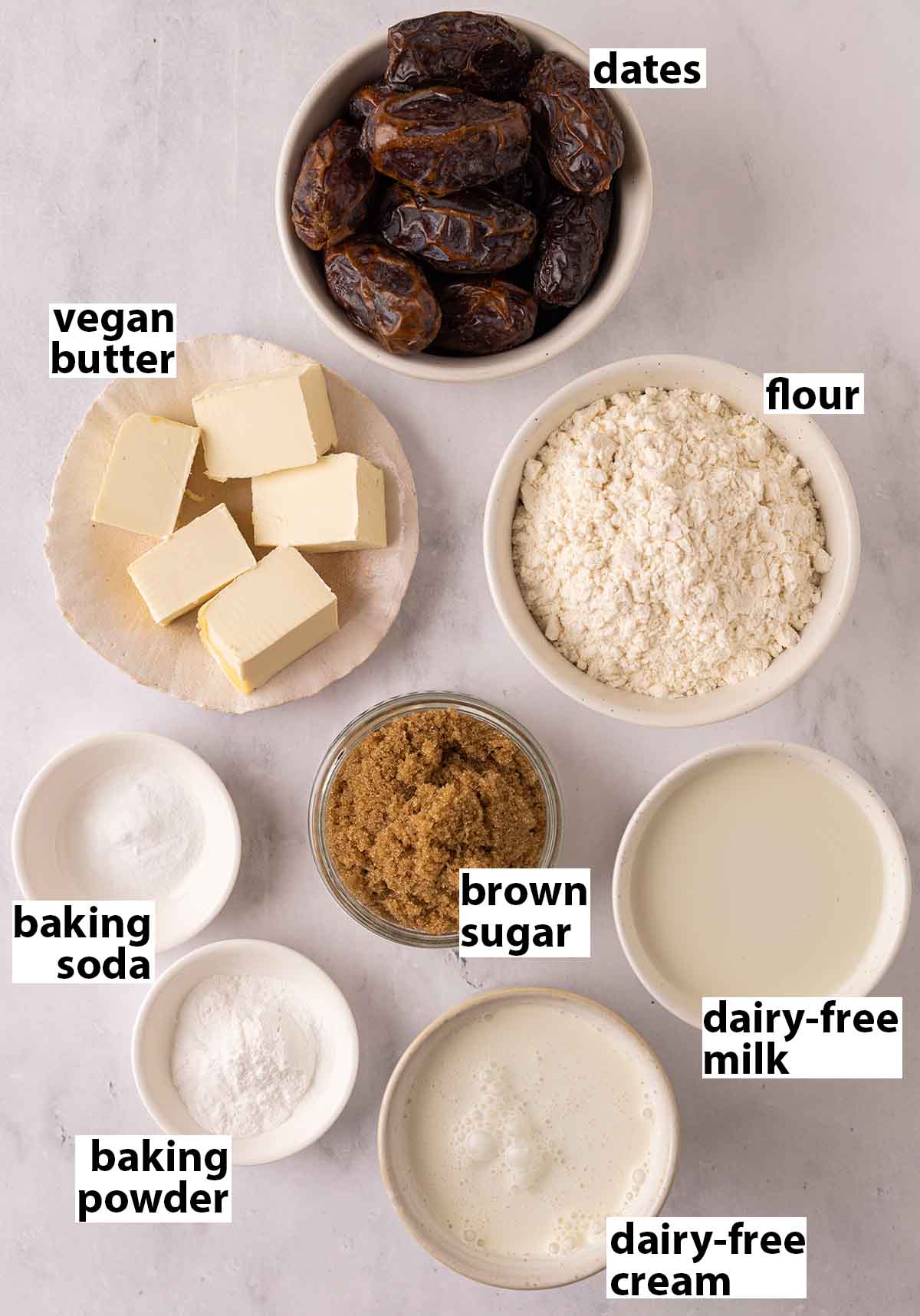 Flat-lay of ingredients in small dishes for sticky toffee pudding.