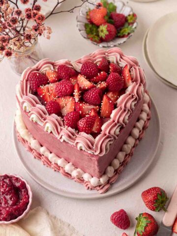 Decorated heart cake on angle.