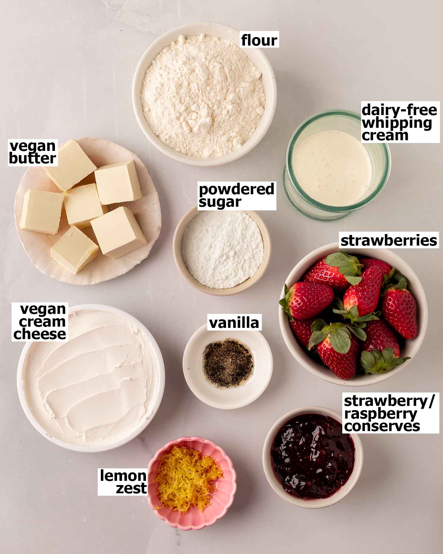 Flat-lay of ingredients for vegan strawberry and cream tart.