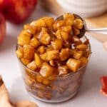 Small glass jar packed with caramelized apples.