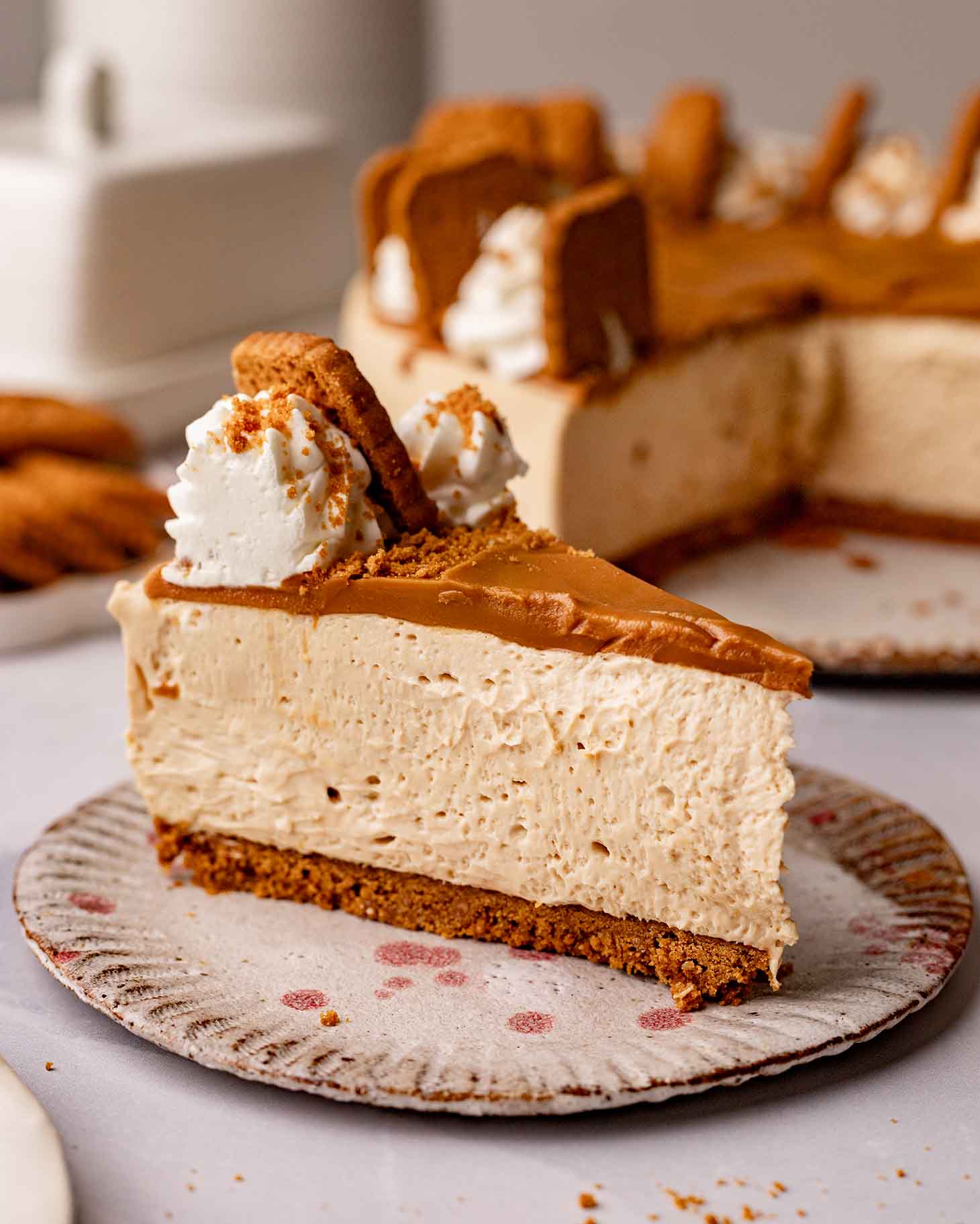 Close up of one slice of Biscoff cheesecake.